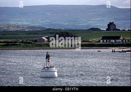 THE METAL MAN LIGHTHOUSE, ROSSES POINT, OYSTER ISLAND, CONEY ISLAND, COUNTY SLIGO, IRELAND. ROSSES POINT IS WHERE POET, DRAMATIST AND NOBEL PRIZE WINNER OF LITERATURE, WILLIAM BUTLER YEATS AND HIS BROTHER PAINTER JACK YEATS SPENT THEIR SUMMER HOLIDAYS. Stock Photo