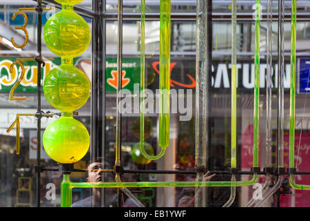 Tourists watching a water clockwork from 13 meters high  in the Europa Centre of Berlin, Germany Stock Photo