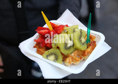 Belgian waffles Brussels topping strawberry kiwi cheap tourist snack Stock Photo
