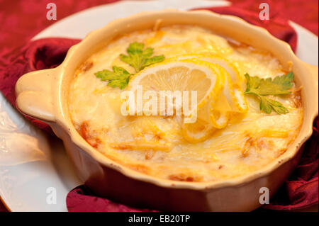 Delicious fish stew dish closeup. At russian dishes - skoblyanka. Stock Photo