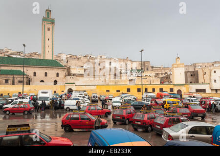 Square with red petit taxis in the medina of Fez Stock Photo