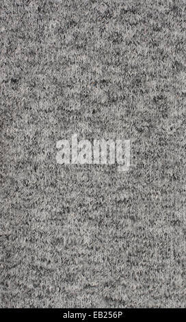 Fine grey knitted fabric as an abstract background texture Stock Photo