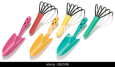 garden trowels and and rakes photographed on a white background Stock Photo