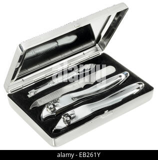 Open travel size grooming kit in a silver case with mirror photographed on a white background. Stock Photo