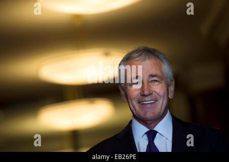 US Secretary of Defense Chuck Hagel smiles as he prepares to greet New Zealand Minister of Defense Gerry Brownlee at the Pentagon November 24, 2014 in Arlington, VA. Defense Secretary Chuck Hagel announced his resignation November 24, 2014. Stock Photo