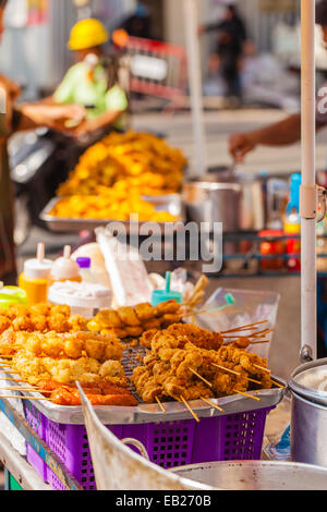 Food snacks on sale in a thai street market in Bangkok, Thailand Stock Photo