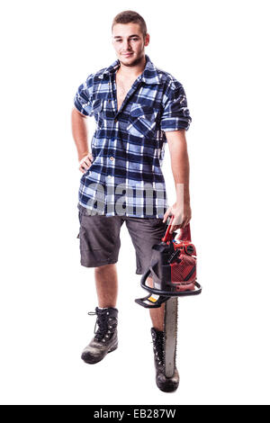 a young lumberjack wearing a checkered shirt and holding a chainsaw isolated over white background Stock Photo