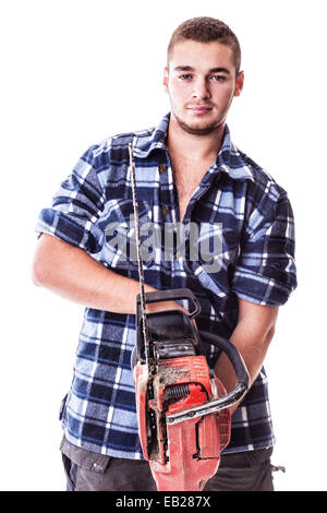 a young lumberjack wearing a checkered shirt and holding a chainsaw isolated over white background Stock Photo