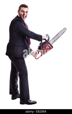 a young businessman holding a red chainsaw isolated over a white background Stock Photo