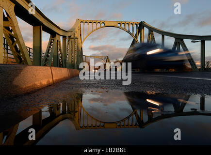 Potsdam, Germany. 24th Nov, 2014. Cars drive over the historical Glinicker Bridge in Potsdam, Germany, 24 November 2014. The bridge, built from 1904-1907, will be closed to traffic for the first time since the fall of the Berlin Wall in November 1989 from Thursday 27 November 2014 to Monday 01 December 2014 for the shooting of a film by American director Steven Spielberg. The bridge is a Cold War symbol; the border between West Berlin and the Soviet Zone bisected the structure. Photo: RALF HIRSCHBERGER/dpa/Alamy Live News Stock Photo