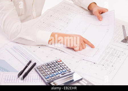 Close-up of Male Architect hand  pointing on Blueprint over white Stock Photo