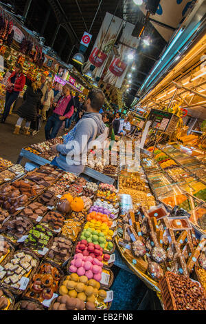 Dried fruit and candies stall at Boqueria food market, Barcelona, Catalonia, Spain Stock Photo