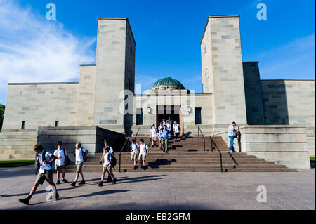 School children exit the Australian War Memorial after a educational school excursion. Stock Photo