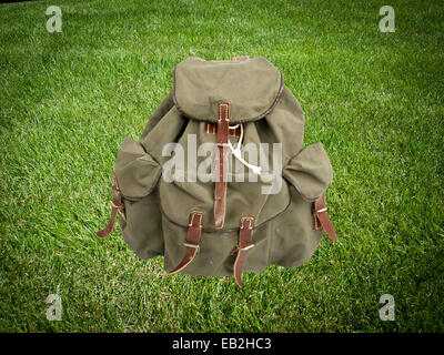 adventure backpack on green grass Stock Photo