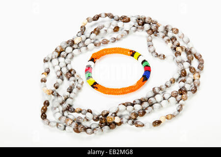 beaded Zulu necklace with bright orange armband Stock Photo