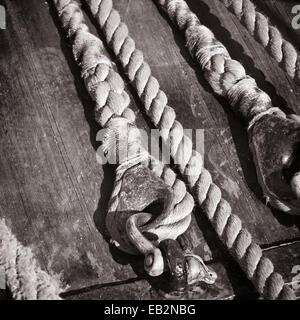 The ropes braided in bays on an ancient sailing vessel Stock Photo