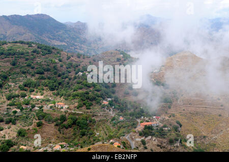 View over the Sicilian countryside with low cloud from the summit of Monte Venere Sicily Italy Stock Photo