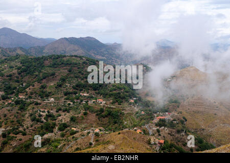 View over the Sicilian countryside with low cloud from the summit of Monte Venere Sicily Italy Stock Photo