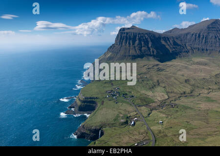 Cliffs and a small village, Gásadalur, Vágar, Faroe Islands, Denmark Stock Photo