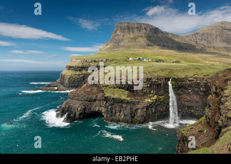 Waterfall on the cliffs near a village, Gásadalur, Vágar, Faroe Islands, Denmark Stock Photo