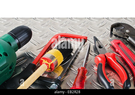 Set of working tools on a metal surface Stock Photo
