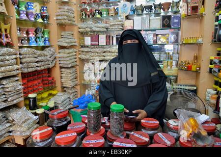 Incense seller at her booth on the incense market, Salalah, Dhofar Region, Orient, Oman Stock Photo