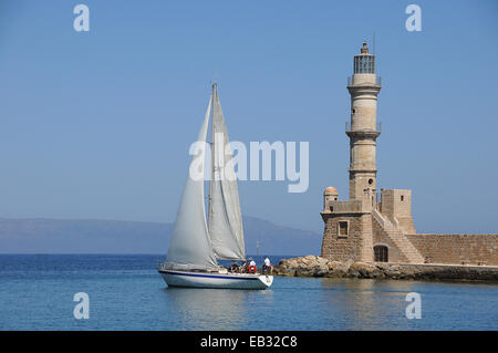 Sailboat and lighthouse, Chania, Crete, Greece Stock Photo