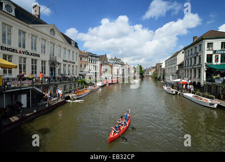 Excursion boat, old guild houses along the Graslei steet with the Leie River, Patershol, Ghent, Flemish Region, Belgium Stock Photo