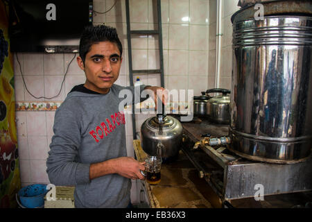 Boy selling tea, Erbil, Arbil Province, Iraqi Kurdistan, Iraq Stock Photo