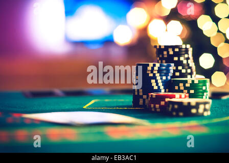 Stack of poker chips on a poker table at Christmas Stock Photo