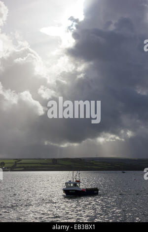 Fishing boat on choppy waters by Konstantinos Volanakis Stock Photo - Alamy