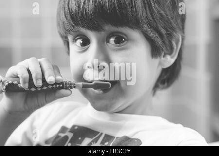 Portrait of a boy  brushing his teeth Stock Photo