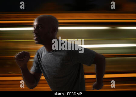 Blurred view of Black man running Stock Photo