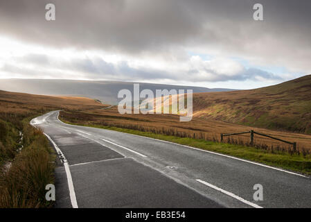A6024 Woodhead road. Looking downhill towards Woodhead with sun breaking through the low cloud. Stock Photo