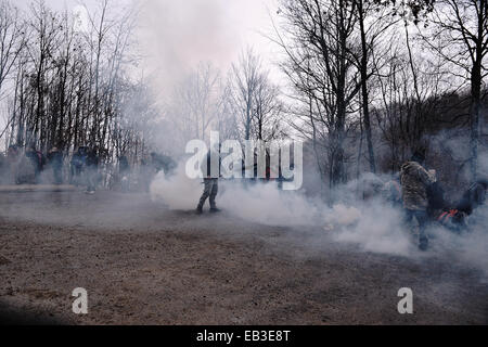 A demonstrator walks after a tear gas attack by the police during a demonstration against the operation of gold mines in Skouries, Chalkidiki, Greece