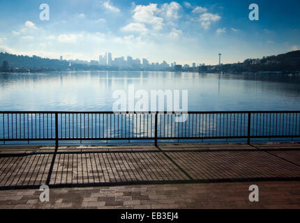 Banister overlooking Seattle city skyline from urban waterfront, Washington, United States Stock Photo