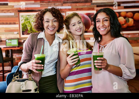Women having juice together in cafe Stock Photo