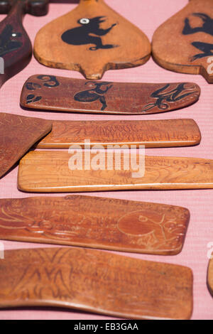 Chile, Easter Island aka Rapa Nui. Typical carved wooden souvenir handicrafts for sale around. Stock Photo