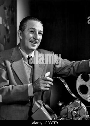 Portrait of Walt Disney looking over footage in the movieola editing machine at Disney Studios December 1954. Walt Disney invited officials from Orange County to his studios to discuss his plans for creating Disneyland. Stock Photo