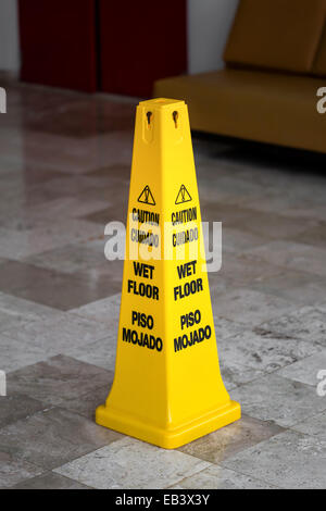 Lobby floor with caution wet floor sign Stock Photo
