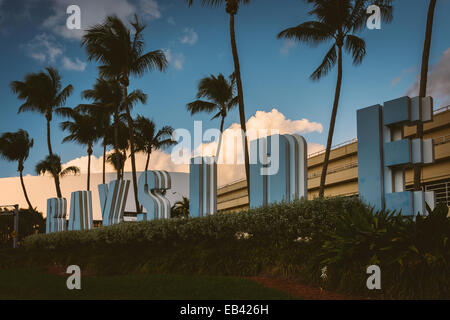 Palm trees and Bayside sign in downtown Miami, Florida. Stock Photo