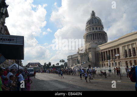 Athletes in Havana, Cuba participate reach the finish line of the Marabana marathon in front of the Capitolo building Stock Photo