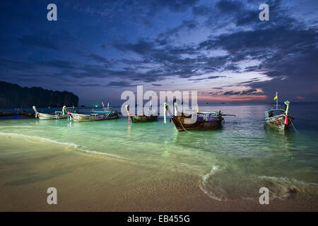 longtail boats at sunset, Ao Nang, Thailand Stock Photo