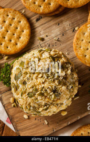 Homemade Cheeseball with Nuts and Wheat Crackers Stock Photo