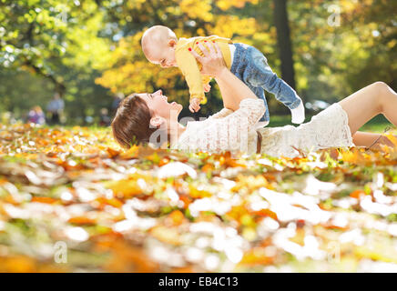 Autumn portrait of mother and baby