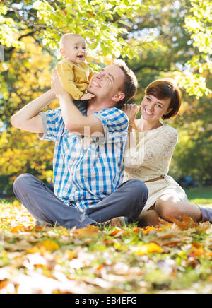 Young parents enjoying spare time with child Stock Photo