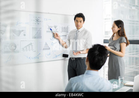 Young business people talking in meeting Stock Photo