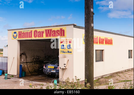 A hand car wash at the side of the road in the Uk Stock Photo