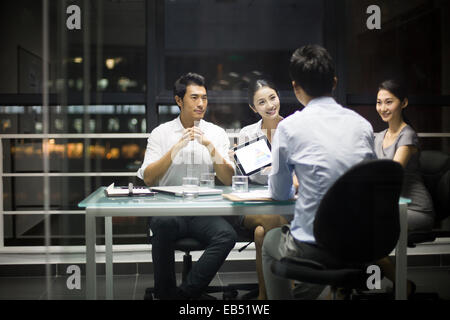 Young business people talking in meeting Stock Photo