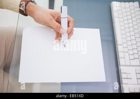 Hand of a businessman writing with a marker Stock Photo